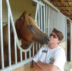 county extension agent, Brenda Jackson, outside the stall of a horse