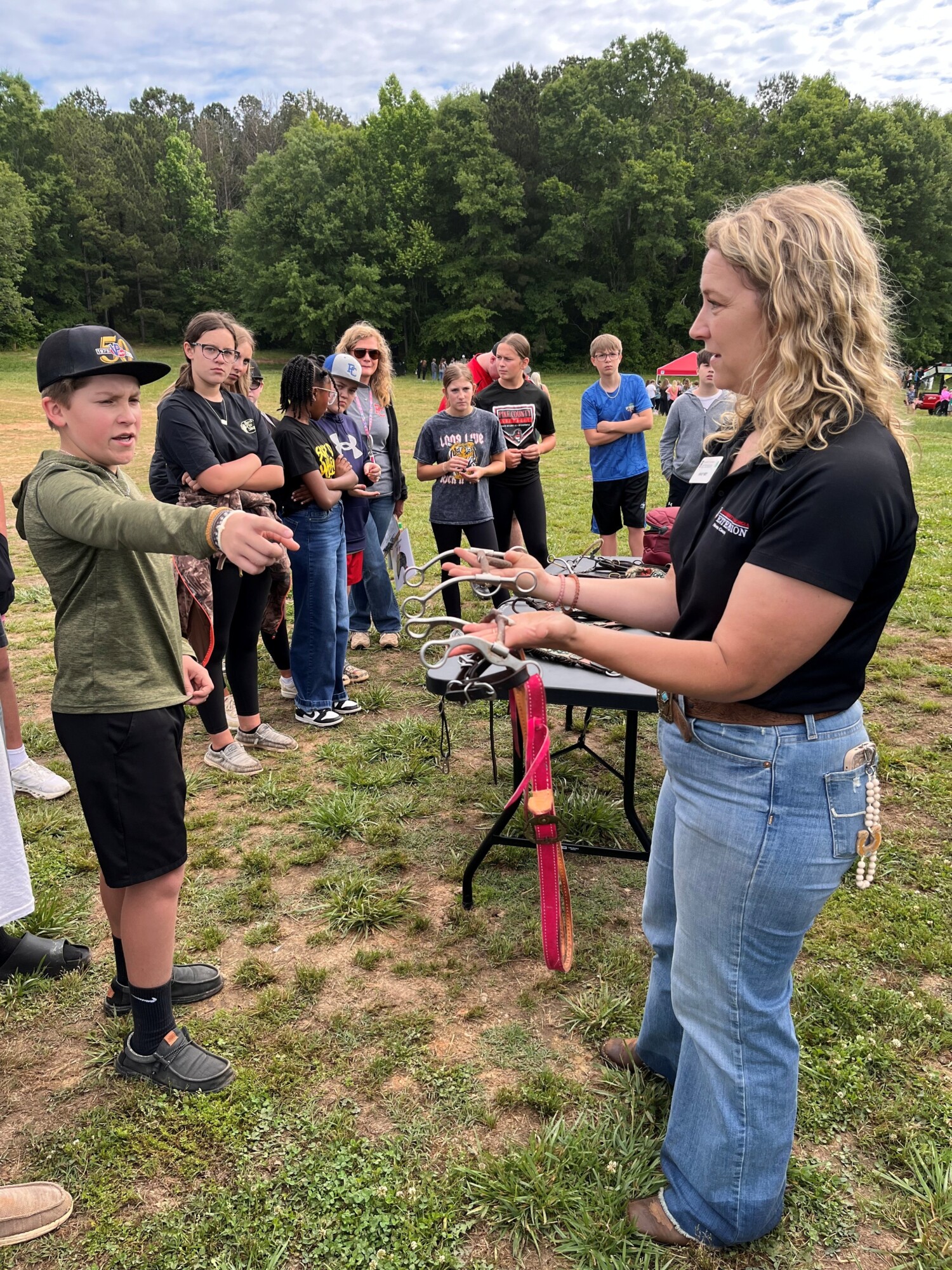 county extension agent, Ashley Best, conducting a youth horse educational activity